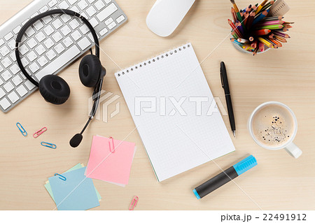 Office desk with headset, notepad and pc Office desk with headset, notepad and pc 22491912