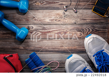 Sport stuff on wooden table, top view Sport stuff on wooden table, top view 22492018