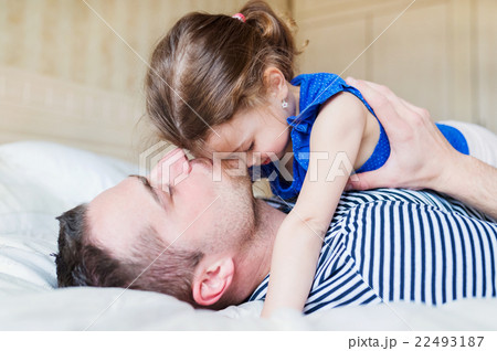 Father having fun with his cute little daughter Father having fun with his cute little daughter 22493187
