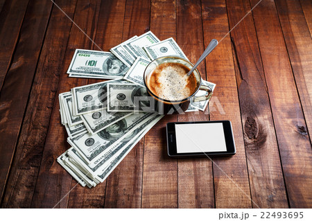 Coffee cup, money and phone 22493695