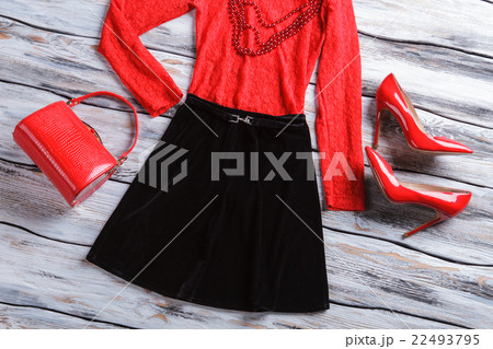 Black skirt and red bag. Black skirt and red bag. 22493795