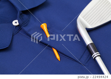 Blue polo shirt and golf equipments 22494424