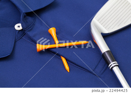 Blue polo shirt and golf equipments 22494425
