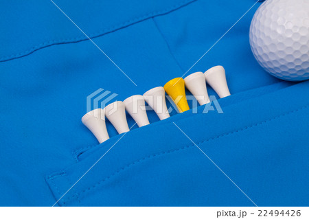 Blue trousers  and golf equipments 22494426