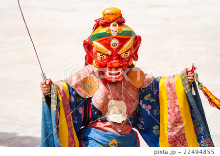 Monk performs a masked dance of Tibetan Buddhism 22494855