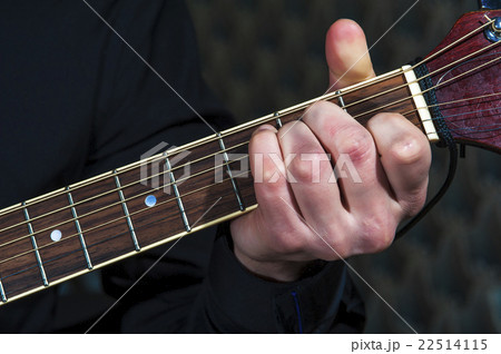 Guitarist playing on guitar, closeup Guitarist playing on guitar, closeup 22514115
