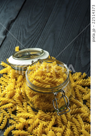 Pasta fusilli in a jar on wooden background Pasta fusilli in a jar on wooden background 22514373