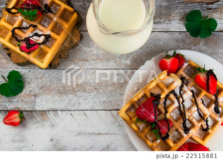 Belgium waffles with strawberries and chocolate. Belgium waffles with strawberries and chocolate. 22515881