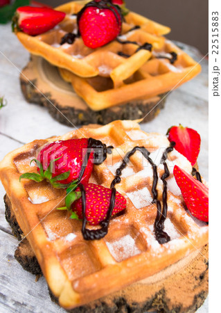 Belgium waffles with strawberries and chocolate. Belgium waffles with strawberries and chocolate. 22515883