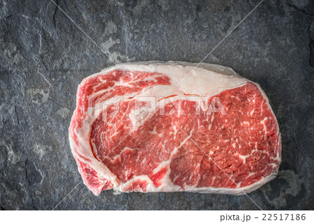 Great Ribeye Steak on a gray-blue slate 22517186