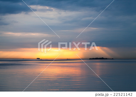Sunset over Baltic Sea. Cloudy sky, still water Sunset over Baltic Sea. Cloudy sky, still water 22521142