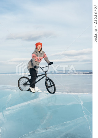 Girl on a bmx on ice. Girl on a bmx on ice. 22523707