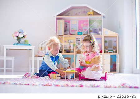 Kids playing with stuffed animals and doll house 22526735