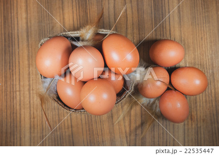 Eggs in basket on wood.eggs.egg.brown.rawfood Eggs in basket on wood.eggs.egg.brown.rawfood 22535447