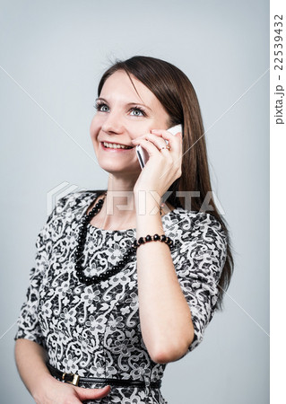 Happy woman speaks on the phone Happy woman speaks on the phone 22539432
