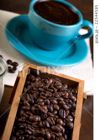 Cup of coffee, containers filled with cofee beans 22544595