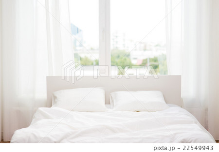 bed at home bedroom 22549943
