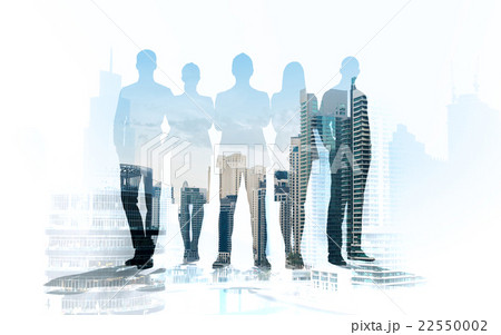 business people silhouettes over city background business people silhouettes over city background 22550002