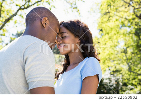 Couple standing face to face in the park 22550902