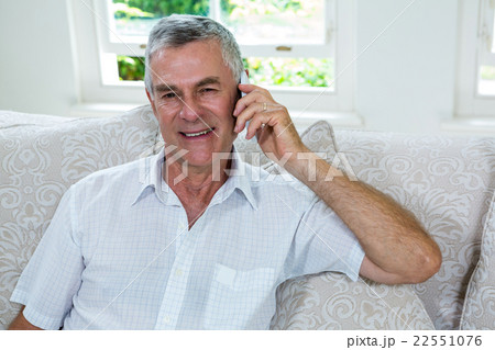 Portrait of happy senior man talking on mobile phone 22551076