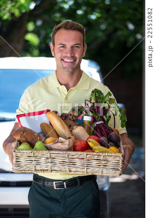 Happy man delivering groceries Happy man delivering groceries 22551082