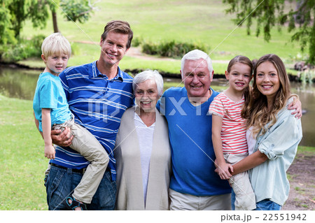 Multi-generation family standing in the park Multi-generation family standing in the park 22551942