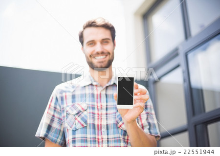 Happy man holding mobile phone Happy man holding mobile phone 22551944