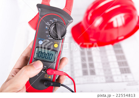 Hand of technician hold digital clamp multimeter 22554813