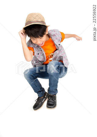 Asian cute boy is jumping with smile face Asian cute boy is jumping with smile face 22556922