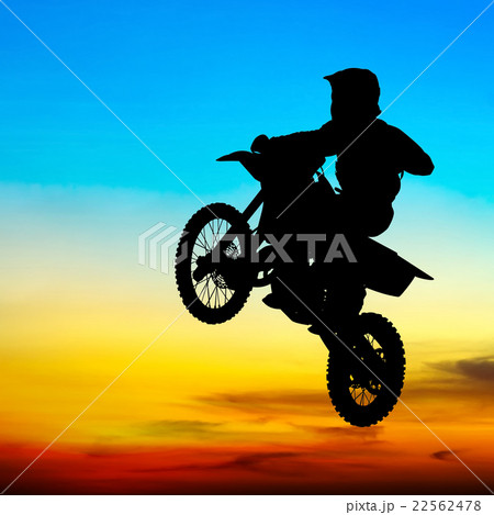 silhouette of motocross rider jump in the sky 22562478