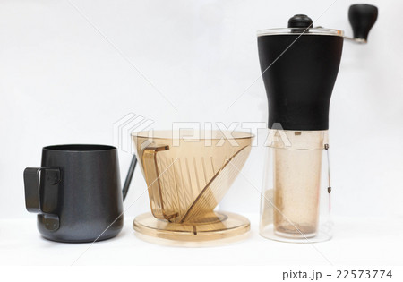 Coffee grinder , filter cup and small black pot 22573774