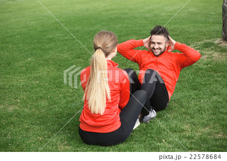 Sport man and woman training in park 22578684