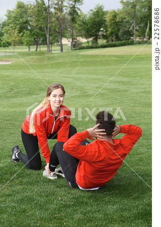 Sport man and woman training in park 22578686