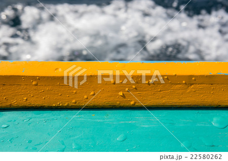 gunnel with wet drop water on blurred waving back 22580262