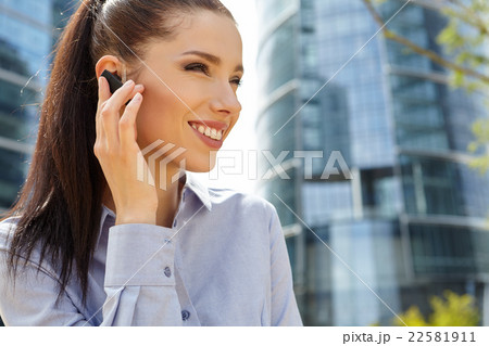 Businesswoman with Bluetooth Businesswoman with Bluetooth 22581911