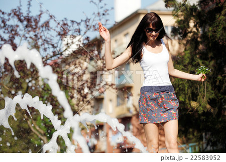 Portrait happy vomen near the fountain Portrait happy vomen near the fountain 22583952