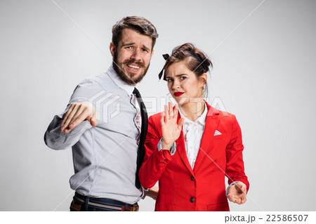 The business man and woman communicating on a gray The business man and woman communicating on a gray 22586507