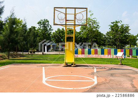 Outdoor basketball court with two hoops 22586886