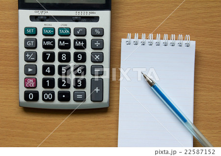 Calculator, notebook and pen 22587152