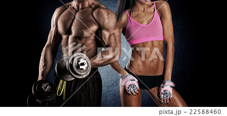 athletic couple poses for the camera athletic couple poses for the camera 22588460