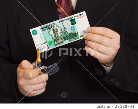 Hands and burnning russian money 22588741