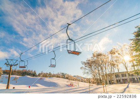 Sunset and Ski lift going over the mountain 22592836