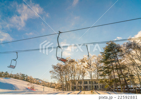 Sunset and Ski lift going over the mountain 22592881