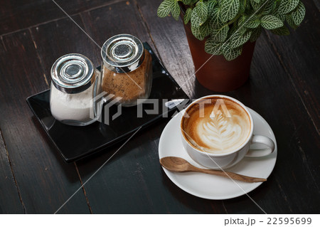 Cup of latte coffee on wooden table 22595699