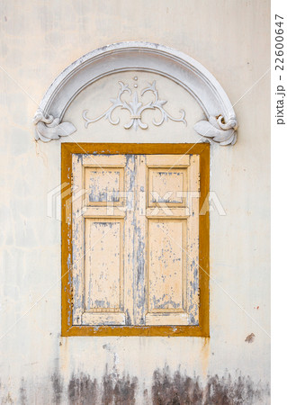 Detail of small old wooden gate painted in yellow Detail of small old wooden gate painted in yellow 22600647