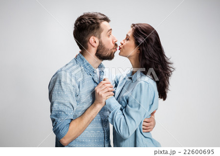Portrait of happy couple on gray background Portrait of happy couple on gray background 22600695