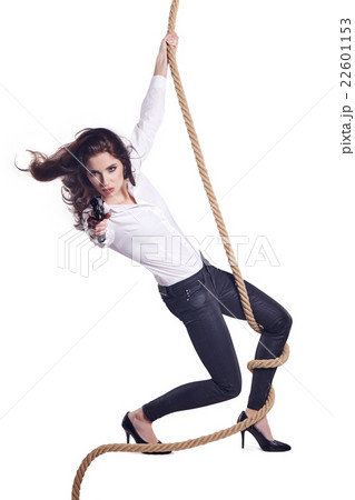 Young woman holding a gun 22601153
