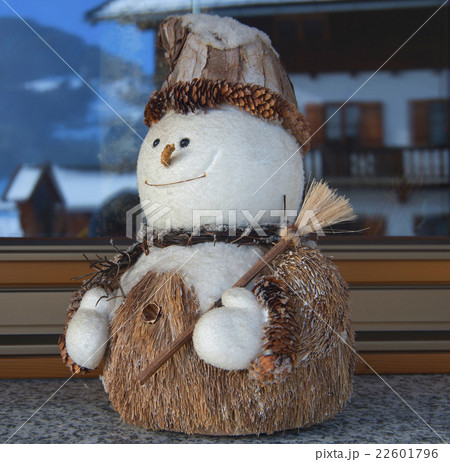 cheerful snowman with broom 22601796