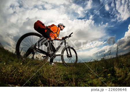 Young man travel by bicycle on rural road 22609646