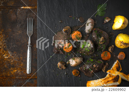 Beef bourguignon on the black stone, potatoes 22609902